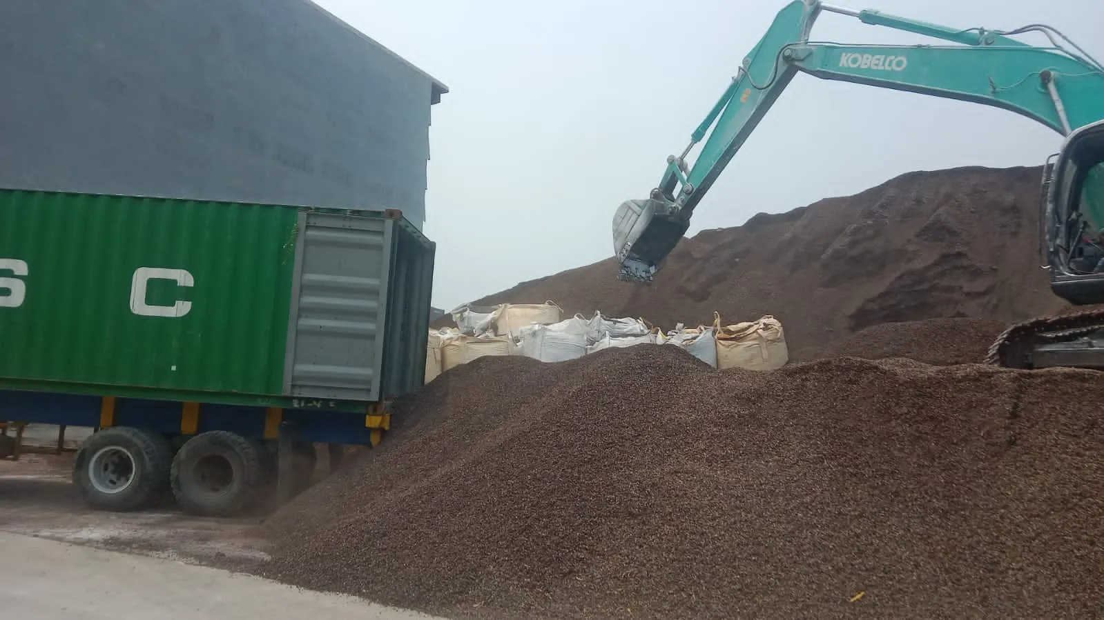 Excavator loading palm kernel shell